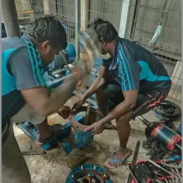 Hydrology technicians overhauling a pool circulation pump