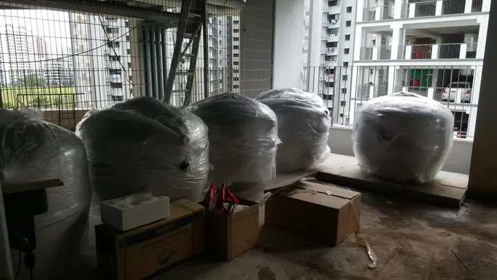 Wrapped filter vessels prepared beside an equipment room